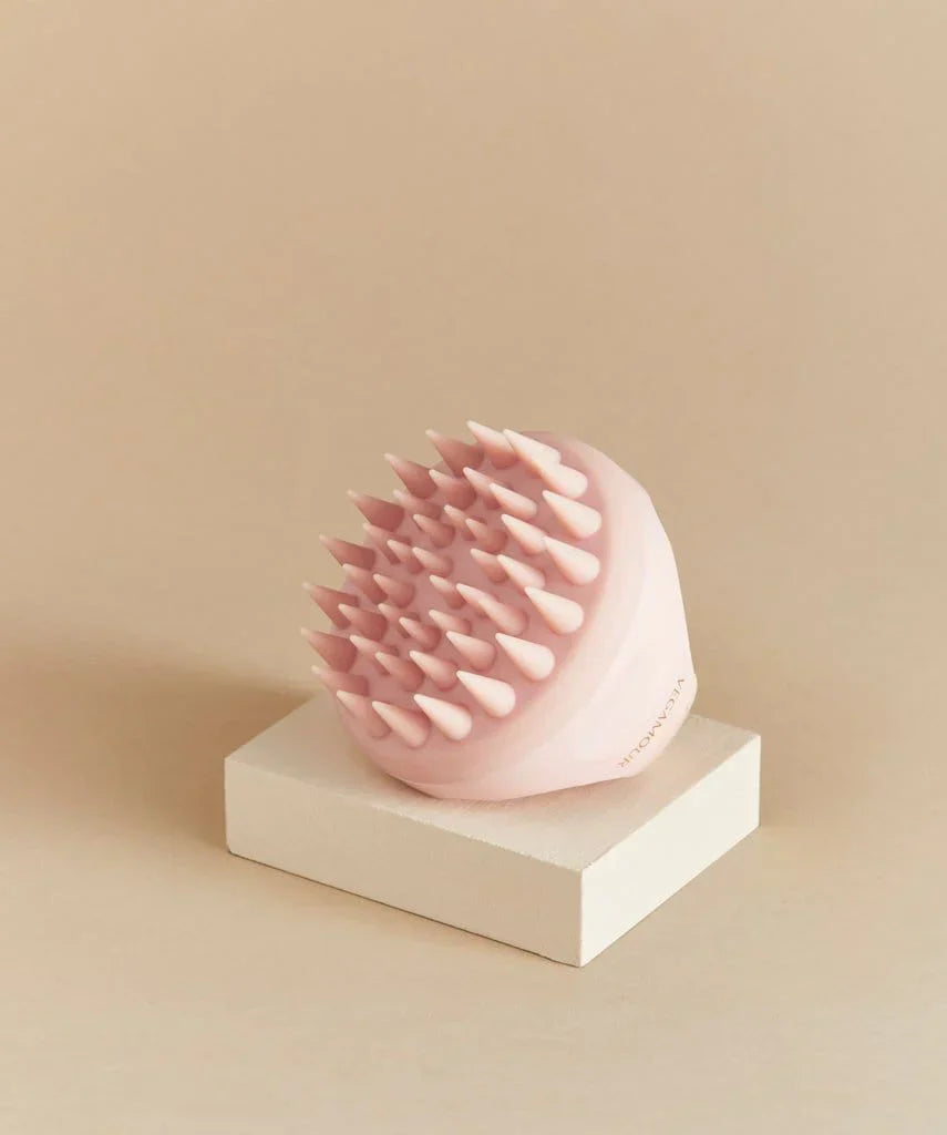 scalp-massager-brown-background-matching